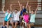 Volleyball coach and female player having fun in the court