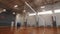 Volleyball net above empty field in sports school gym