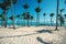 Volleyball net on tropical beach and caribbean sea