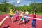 Volleyball net view on girls trying to catch ball