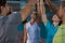 Volleyball players giving high-five seen through net