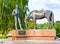 VOLOGDA, RUSSIA - AUGUST 15, 2016: Monument to the poet Konstantin Batyushkov. A man reading a book for a horse