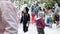 Vologda, Russia, July 2019: children play,throw foam falling from above people