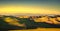 Volterra panorama, rolling hills and green fields at sunset. Tuscany, Italy