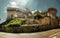 Volterra prison`s amber stone walls under bright sun