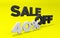 Volumetric inscription Sale 40% off in black and white colors on a yellow background.