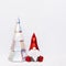 Volumetric paper Christmas gnome and holographic paper Christmas tree, polygonal figures dwarf and fir tree