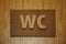 Volumetric plaque on wooden doors toilet rooms - Water Closet - WC.