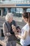 Volunteer bringing bread and tea for poor hungry woman