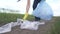Volunteer collects plastic trash in the park. recycle plastic bottle cleanup ecology concept blurred background. girl