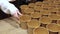 Volunteer. Female hand unfolds bowls pouring soup or porridge to feed homeless