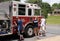 Volunteer firemen cleaning the fire truck