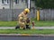 Volunteer first responder connecting fire hose to water main