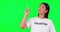 Volunteer, green screen and woman pointing finger at space for advertising, charity or information. Happy asian person