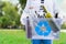 Volunteer holding glass garbage container for recycling