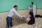 Volunteer man donating clothes for babies in the maternity hospital during children protection day