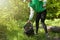 Volunteer picking trash in the forest