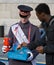 A volunteer selling poppies on Armistice Day