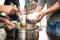 Volunteer serving food to poor people in charity centre