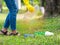 Volunteer women collect plastic water bottles in the park area, From people who refuse to throw in the trash