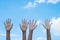 volunteering concept. Hands of people with blue sky on background