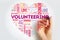 Volunteering word cloud collage with marker, heart concept background