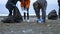 Volunteers clean up trash on the beach in the fall. Environmental issues