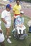 Volunteers coaching handicapped young athlete