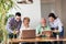 Volunteers help senior people on the computer. Young people giving senior people introduction to internet