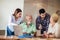 Volunteers help senior people on the computer. Young people giving senior people introduction to internet