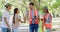 Volunteers meeting with other charity staff to help clean a park. NGO employees greeting people with a handshake