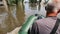 Volunteers sail on boat to evacuate animals and people after detonation of Hydroelectric Power Station. Flooding in