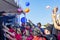 Volunteers Throw Hats and Prizes From the Stage to Excited Fundraiser Participants