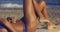 Voluptuous young woman sunbathing in a bikini