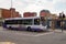 Volvo B7RLE city bus of the First Glasgow transportation company at the bus stop in front of traffic lights