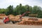 Volvo FH Truck Unloads Logs at Lumber Yard
