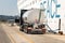 A Volvo truck cistern refueling a cruise ship docked at the Port or Corfu