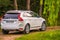 Volvo XC60 white color in green nature
