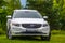 Volvo XC60 white color in green nature