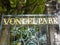 Vondelpark entrance gate in Amsterdam, Netherlands. Dutch public urban park at the city center. Gold letters text