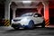 Vorkuta, Komi / Russia - 11 10 2017: Nissan Qashqai white crossover car In a closed parking lot on a dark background