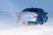 Vorkuta, Komi / Russia - 12 01 2018: Skoda Rapid blue car in winter in snow with headlights on