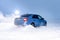 Vorkuta, Komi / Russia - 12 01 2018: Skoda Rapid blue car in winter in snow with headlights on