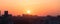 Voronezh city at sunset, against a colorful sky, panoramic aerial view from roof