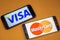 VORONEZH, RUSSIA - 3 may, 2019: Visa logo and mastercard logo on two different phones