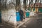 Voronezh, Russia - March 23, 2017: Old homeless man rummages in the dustbin in Voronezh trash