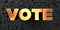 Vote - Gold text on black background - 3D rendered royalty free stock picture