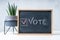 Vote Written On Blackboard. The concept of making choices. Presidential and parliamentary elections. Calling for voting, democracy