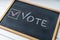 Vote Written On Blackboard. The concept of making choices. Presidential and parliamentary elections. Calling for voting, democracy