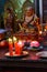 Votive candles and incense, with Buddha